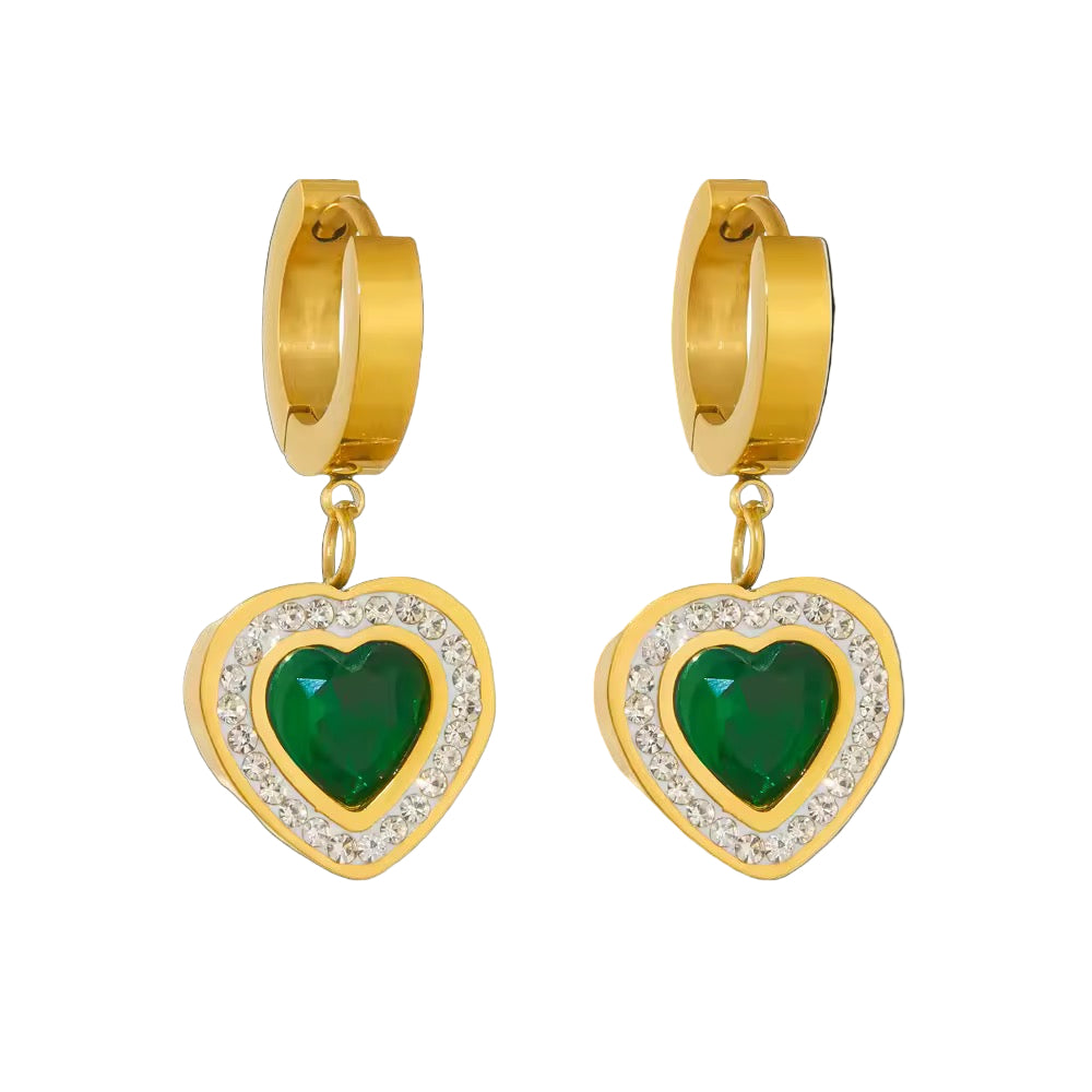 Gold hoop earrings with green heart stones on a white background