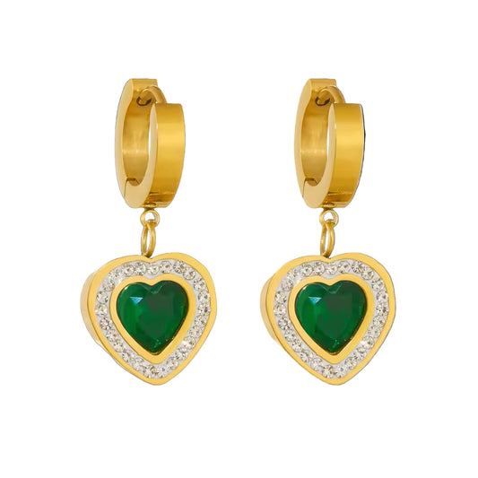 Gold hoop earrings with green heart stones on a white background